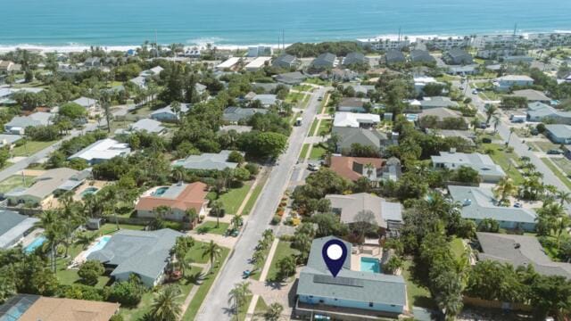 birds eye view of property with a residential view and a water view