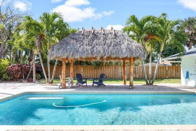 view of pool with a patio, a gazebo, fence, and a fenced in pool