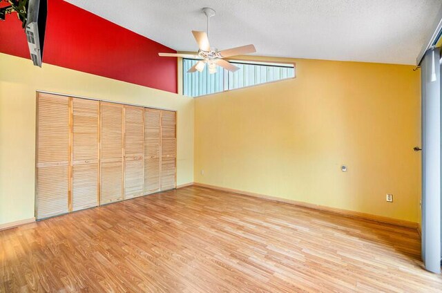 5578 Golden Eagle Cir Unit 5578, Palm Beach Gardens, FL 33418 - interior space with a ceiling fan, vaulted ceiling, a closet, baseboards, and wood finished floors