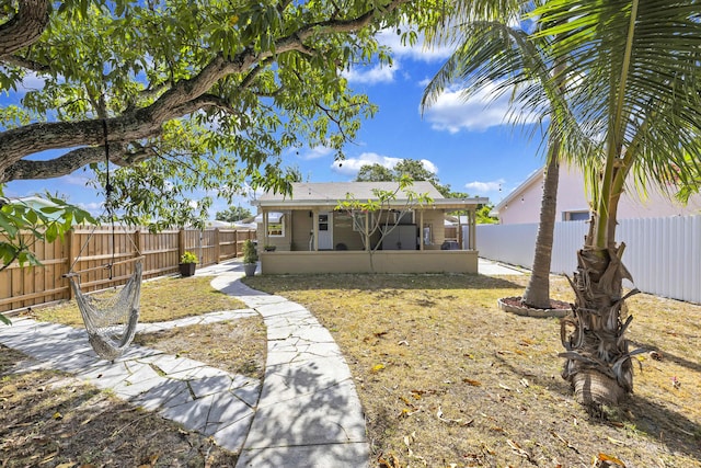 exterior space featuring a fenced backyard