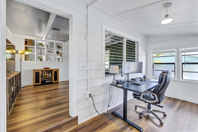 office featuring visible vents and wood finished floors