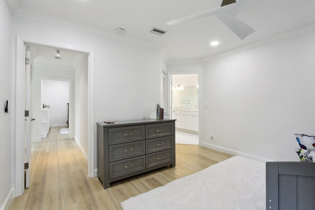 bedroom with baseboards, visible vents, ornamental molding, and light wood-type flooring