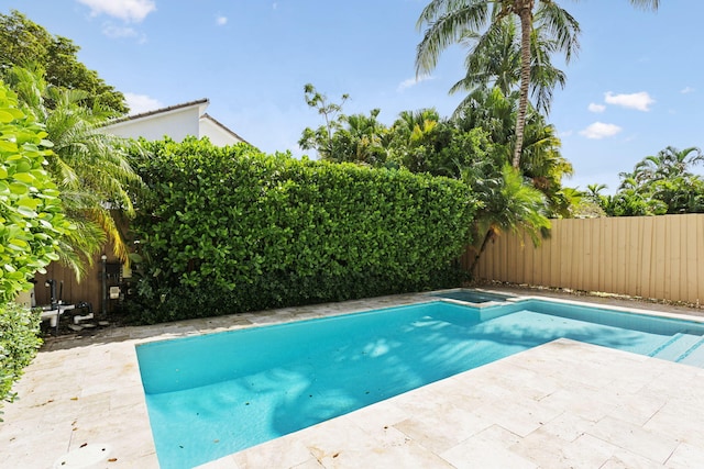 view of pool with a fenced in pool, a fenced backyard, and a patio area