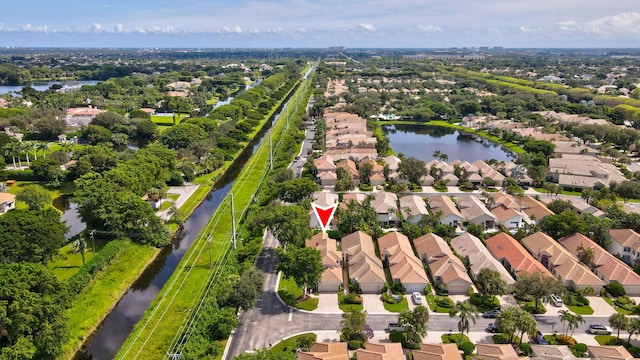 birds eye view of property featuring a water view and a residential view