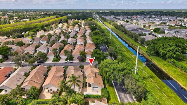 bird's eye view with a water view and a residential view
