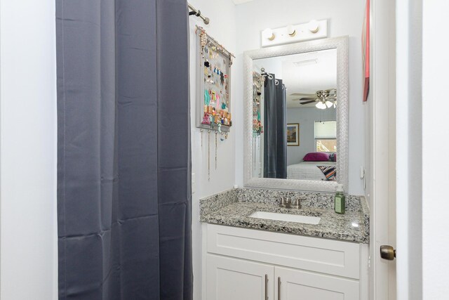 full bathroom featuring vanity and ensuite bathroom