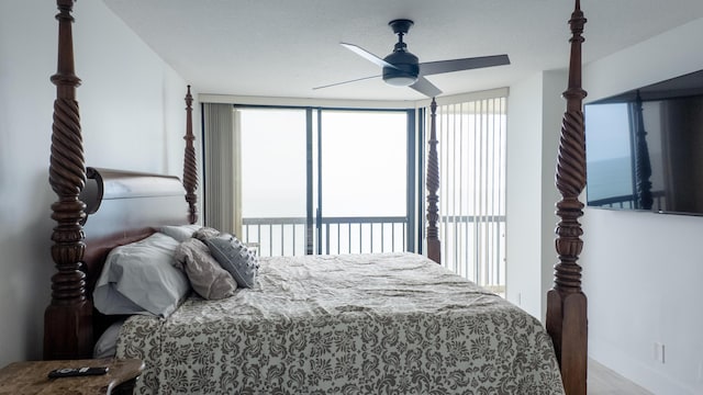 9500 S Ocean Dr Unit 1502, Jensen Beach, FL 34957 - bedroom with multiple windows, a ceiling fan, a water view, and baseboards