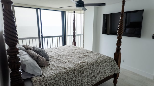 9500 S Ocean Dr Unit 1502, Jensen Beach, FL 34957 - bedroom featuring multiple windows, wood finished floors, and baseboards