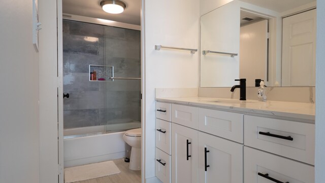9500 S Ocean Dr Unit 1502, Jensen Beach, FL 34957 - full bath featuring toilet, vanity, and combined bath / shower with glass door