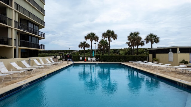 9500 S Ocean Dr Unit 1502, Jensen Beach, FL 34957 - community pool featuring a patio area