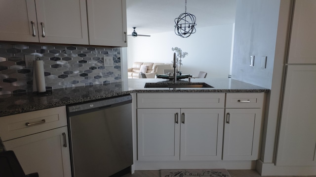 9500 S Ocean Dr Unit 1502, Jensen Beach, FL 34957 - kitchen with stainless steel dishwasher, a sink, tasteful backsplash, dark stone countertops, and white cabinets
