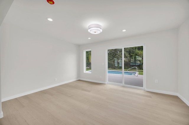 4372 SW Bimini Cir N, Palm City, FL 34990 - unfurnished room with light wood-type flooring, baseboards, and recessed lighting