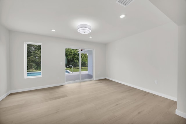 4372 SW Bimini Cir N, Palm City, FL 34990 - empty room with light wood-style flooring, baseboards, and recessed lighting