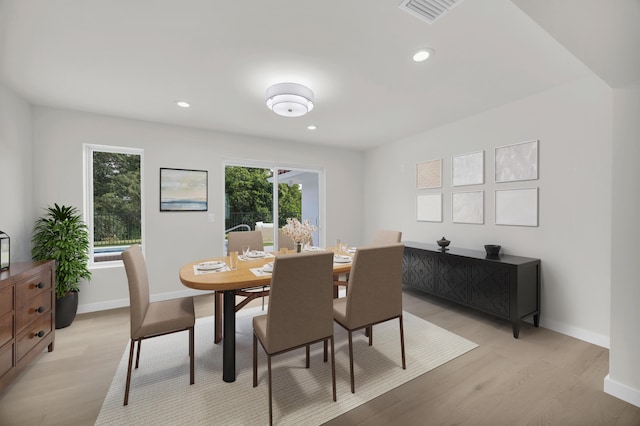 4372 SW Bimini Cir N, Palm City, FL 34990 - dining room with light wood finished floors, baseboards, and recessed lighting