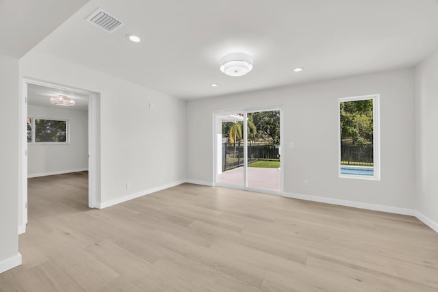 4372 SW Bimini Cir N, Palm City, FL 34990 - unfurnished room with light wood finished floors, healthy amount of natural light, baseboards, and recessed lighting