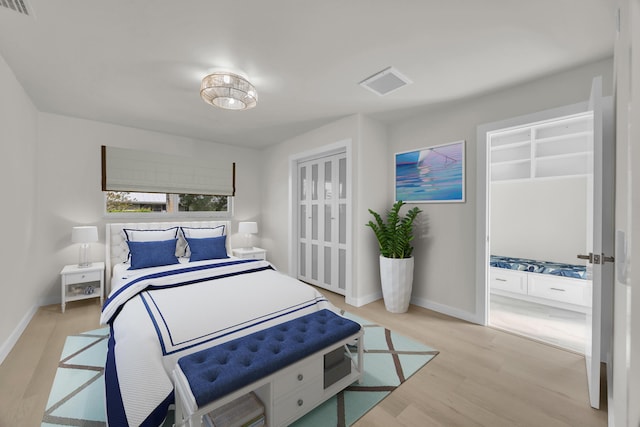 4372 SW Bimini Cir N, Palm City, FL 34990 - bedroom featuring light wood-style floors and baseboards