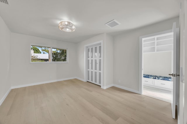4372 SW Bimini Cir N, Palm City, FL 34990 - spare room with light wood-type flooring and baseboards