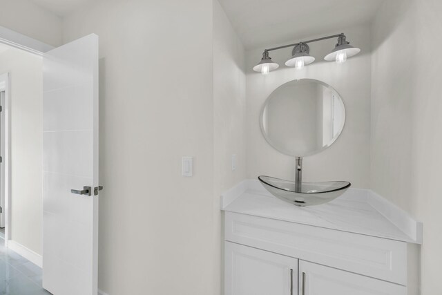 4372 SW Bimini Cir N, Palm City, FL 34990 - bathroom with vanity and baseboards
