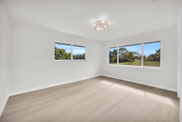 4372 SW Bimini Cir N, Palm City, FL 34990 - unfurnished room with plenty of natural light, light wood finished floors, and baseboards