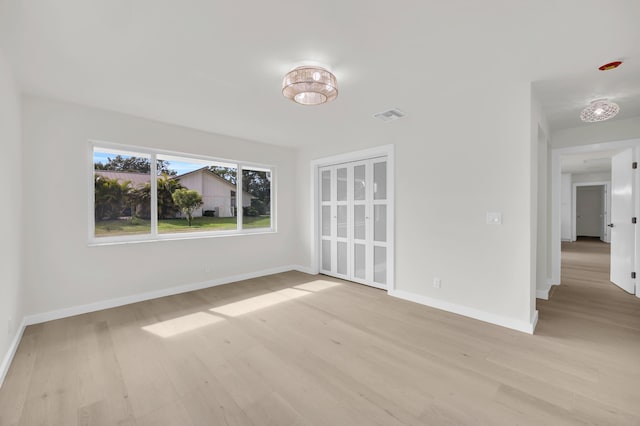 4372 SW Bimini Cir N, Palm City, FL 34990 - unfurnished dining area with light wood-type flooring and baseboards
