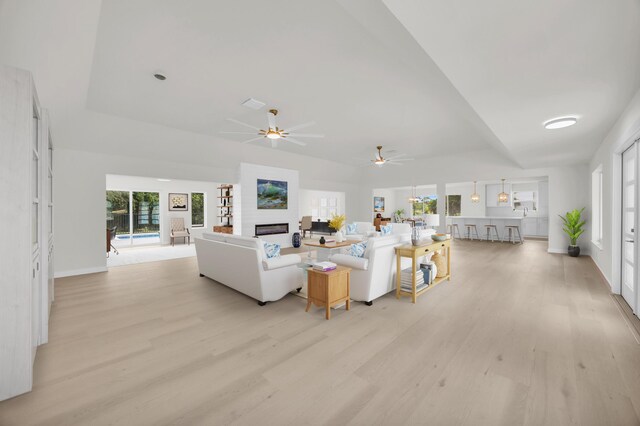 4372 SW Bimini Cir N, Palm City, FL 34990 - living room with light wood-type flooring, a ceiling fan, healthy amount of natural light, and baseboards