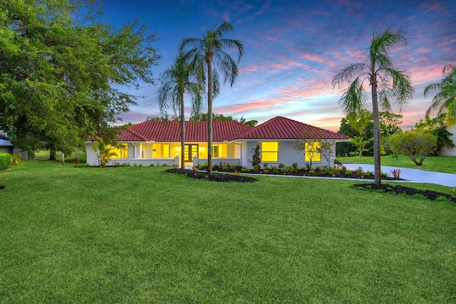 4372 SW Bimini Cir N, Palm City, FL 34990 - single story home with a tiled roof, a lawn, and stucco siding