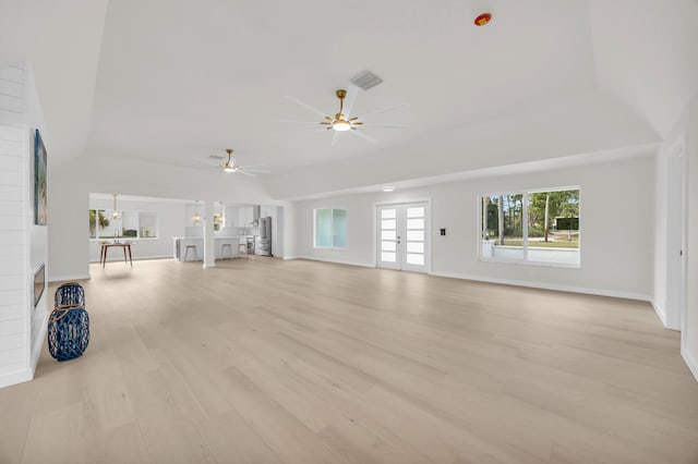 4372 SW Bimini Cir N, Palm City, FL 34990 - unfurnished living room with a ceiling fan, light wood finished floors, baseboards, and french doors