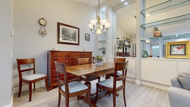 dining space featuring recessed lighting, baseboards, an inviting chandelier, and light wood-type flooring