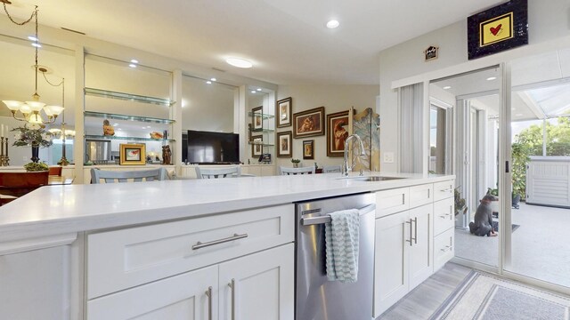 kitchen featuring light countertops, white cabinetry, appliances with stainless steel finishes, and tasteful backsplash