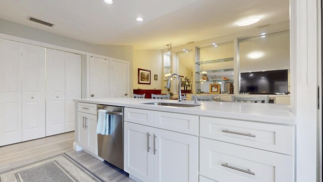 kitchen featuring visible vents, tasteful backsplash, a toaster, stainless steel appliances, and white cabinetry