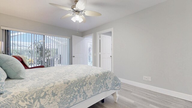 bedroom with light wood-style floors, baseboards, a ceiling fan, and access to exterior
