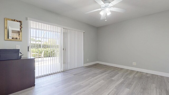 interior space with baseboards, visible vents, ceiling fan, and light wood-type flooring