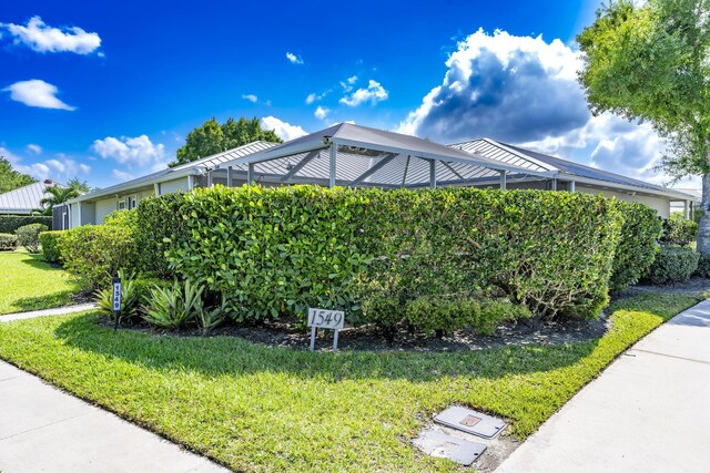 view of home's exterior with a lawn