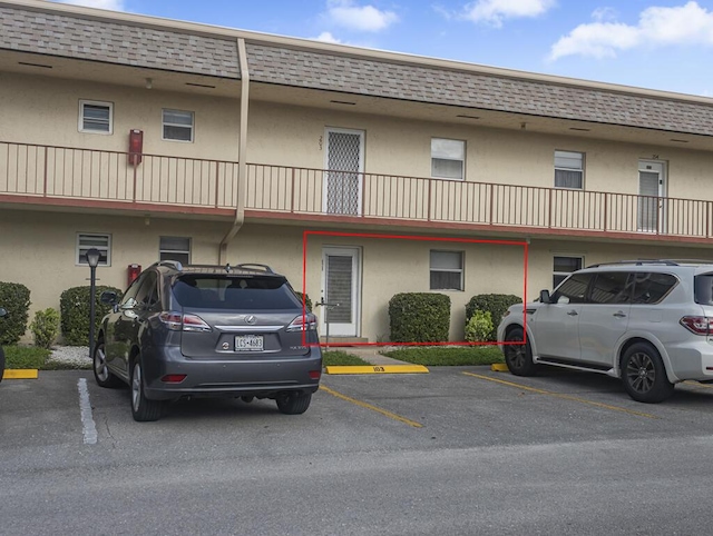103 Oxford 500 Unit 103, West Palm Beach, FL 33417 - view of building exterior featuring uncovered parking