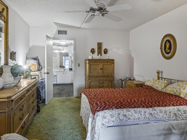 103 Oxford 500 Unit 103, West Palm Beach, FL 33417 - carpeted bedroom with a textured ceiling, ceiling fan, and ensuite bath