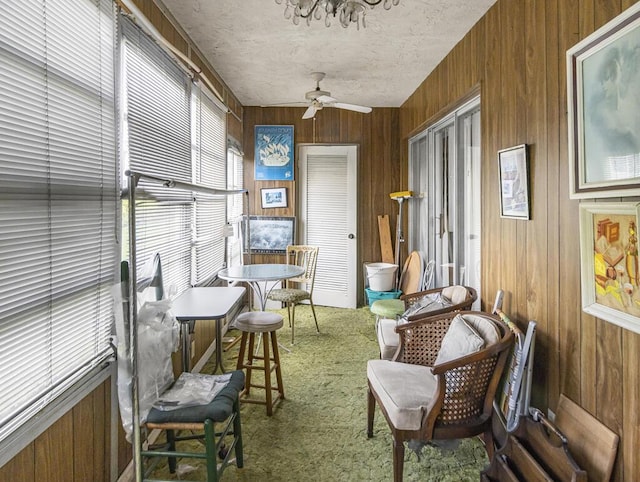 103 Oxford 500 Unit 103, West Palm Beach, FL 33417 - sunroom / solarium with ceiling fan, carpet floors, and wooden walls