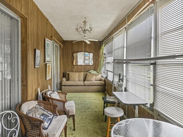103 Oxford 500 Unit 103, West Palm Beach, FL 33417 - sunroom with a ceiling fan and a chandelier