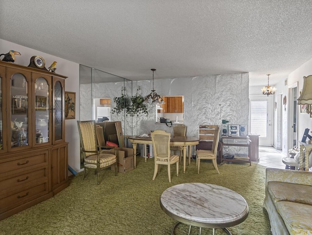 103 Oxford 500 Unit 103, West Palm Beach, FL 33417 - carpeted dining area with a chandelier and a textured ceiling