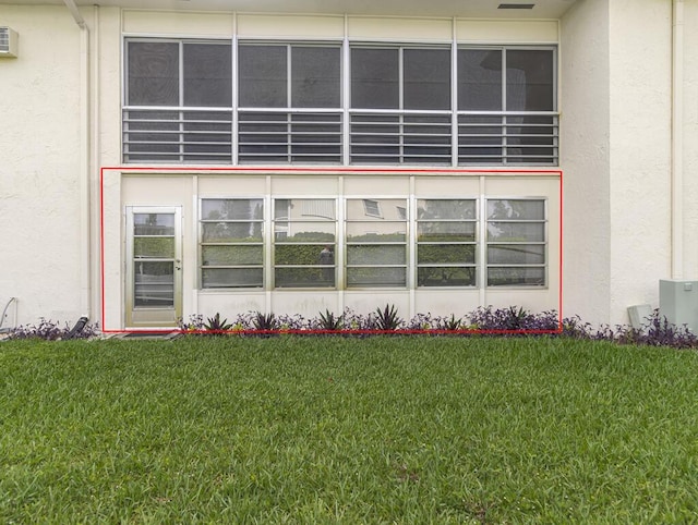 103 Oxford 500 Unit 103, West Palm Beach, FL 33417 - property entrance featuring stucco siding and a lawn