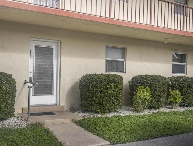 103 Oxford 500 Unit 103, West Palm Beach, FL 33417 - view of exterior entry with stucco siding