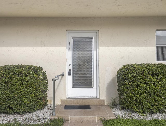 103 Oxford 500 Unit 103, West Palm Beach, FL 33417 - view of exterior entry with stucco siding
