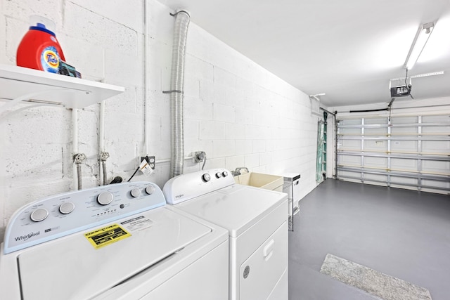 4670 Laurel Tree Rd Unit A, Boynton Beach, FL 33436 - clothes washing area featuring washer and dryer, laundry area, concrete block wall, and a sink