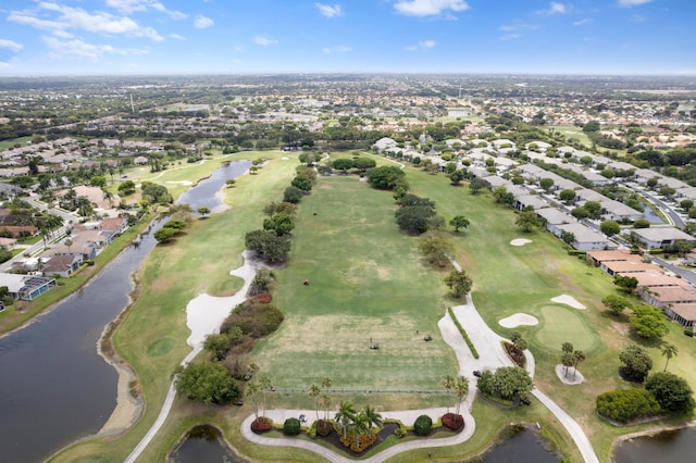 drone / aerial view with a water view, a residential view, and golf course view