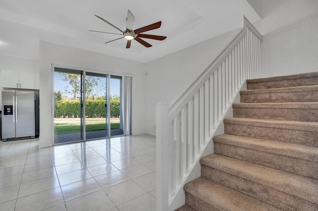 340 Pioneer Way, Royal Palm Beach, FL 33411 - staircase featuring ceiling fan and tile patterned floors