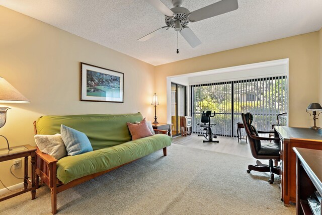 office featuring a ceiling fan and a textured ceiling