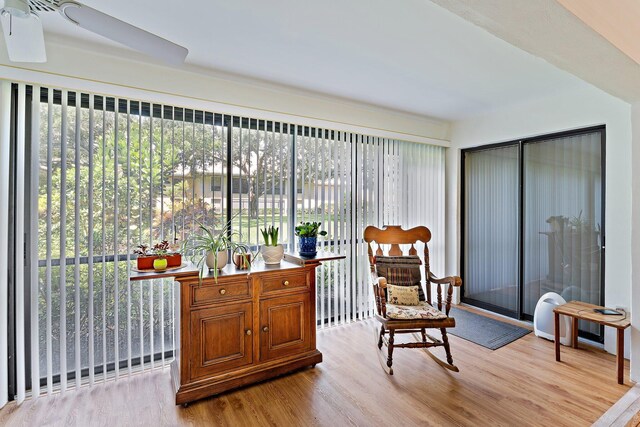 sitting room with light wood-style flooring and ceiling fan