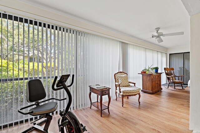 sitting room with wood finished floors and ceiling fan