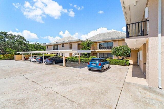 view of partially covered parking lot
