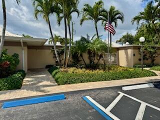 22 SE Turtle Creek Dr Unit B, Jupiter, FL 33469 - view of uncovered parking lot