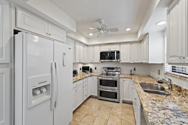 kitchen featuring stainless steel appliances, a sink, ceiling fan, recessed lighting, and light tile patterned floors